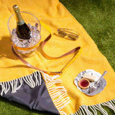 Lifestyle shot of Wool Waterproof Picnic Blanket in Yellow Somerset Dusk